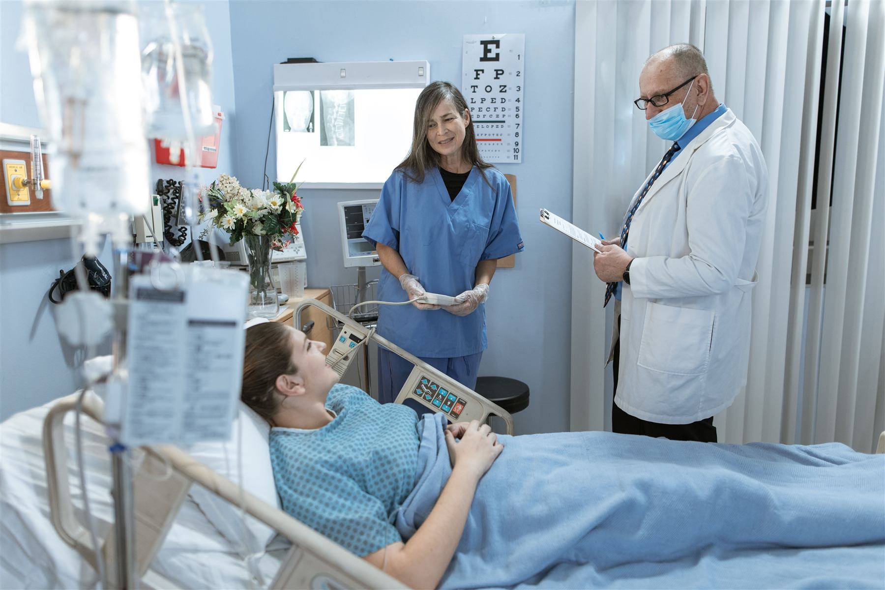 Care team consulting with a patient